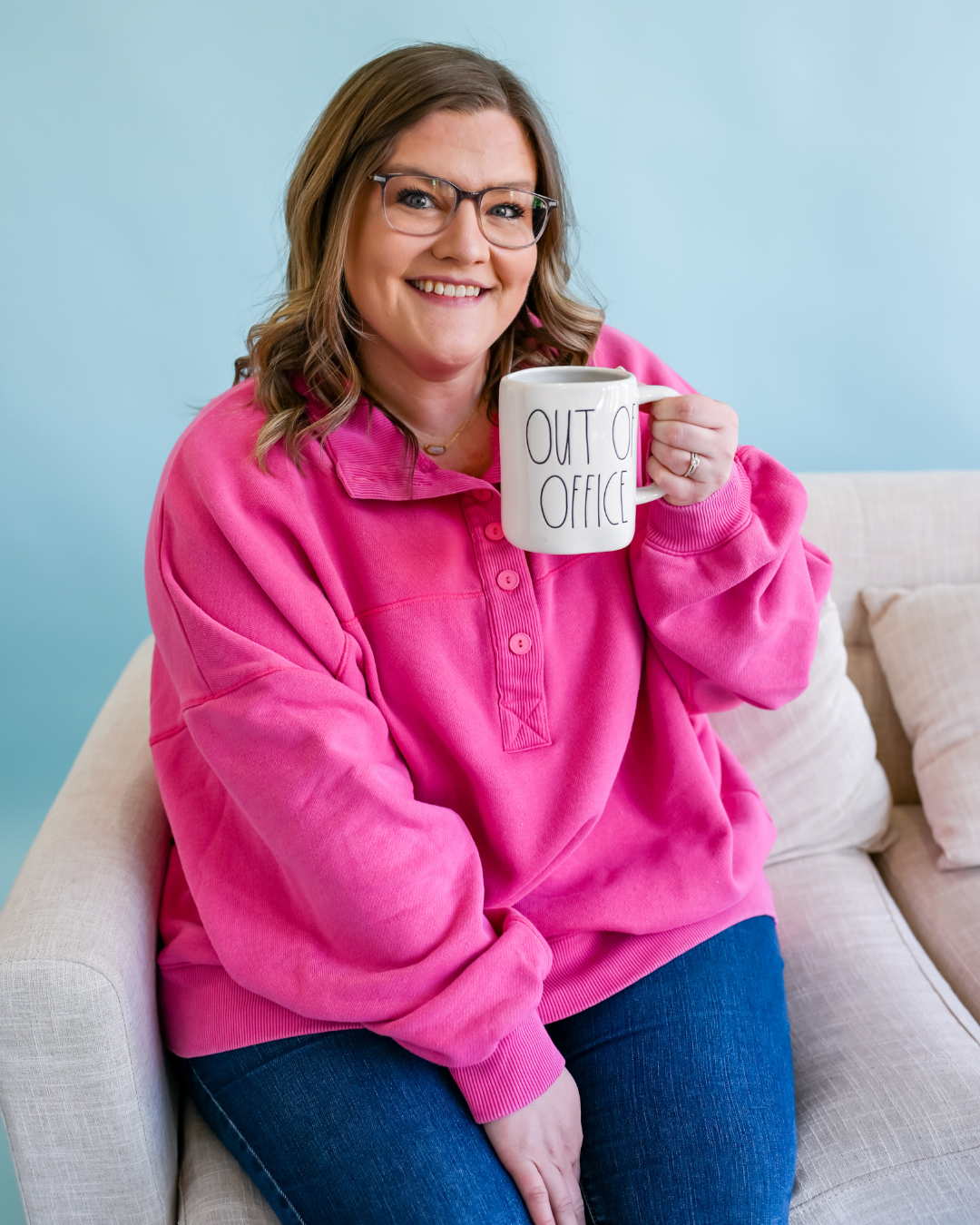 Shelb smiling with an Out of Office mug